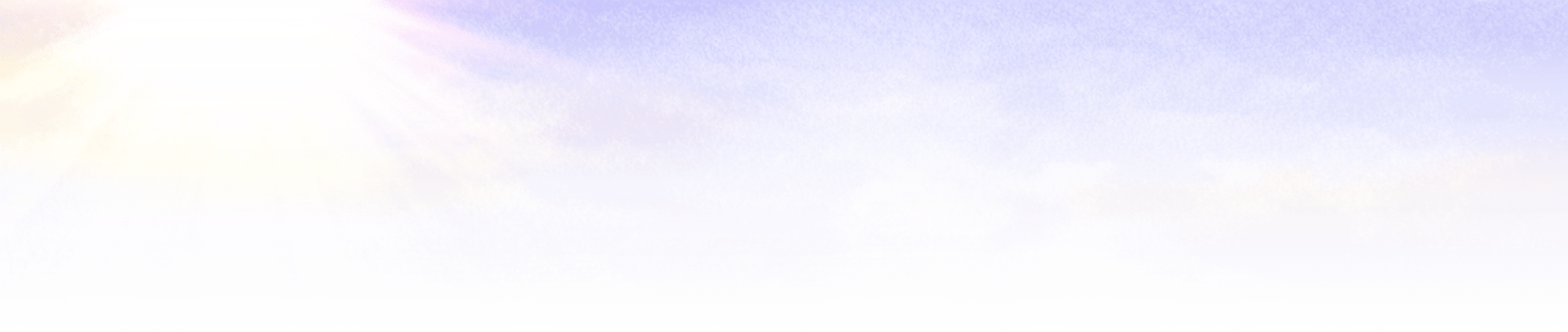 A field of flowers with a blue sky and clouds. Description generated by AI